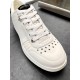 Jimmy Choo Hawaii White Trainer Toe Close-Up Close-up of star perforations and lace detail on Jimmy Choo Hawaii white trainer toe