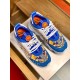 Top-down view of Versace Chain Reaction trainers showcasing blue overlays, baroque print and white laces in blue and yellow