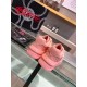 Rear view of both pink Versace Odissea trainers highlighting the debossed logo on the heel counters