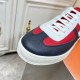 Close-up of the navy and bordeaux textured leather toe on Hermes Boomerang trainers in multicolour