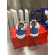 Christian Louboutin Louis Junior Spikes Orlato Heel View in white and blue Rear view of Christian Louboutin Louis Junior Spikes Orlato trainers highlighting blue patterned heel panels and pull tabs in white and blue