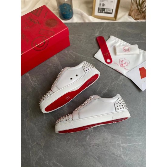 Pair of Christian Louboutin white trainers with red soles and original packaging in white and silver