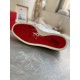 Full view of signature red rubber sole on Christian Louboutin Vieirissima white trainer in white and black