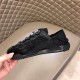 Dolce & Gabbana Black Lace Low Top Slip On Trainers Medial Side Dolce & Gabbana Black Lace Low Top Slip On Trainers medial side view held in hand