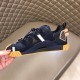 Medial Profile Dolce & Gabbana Blue Trainer Medial side view of Dolce & Gabbana blue fabric trainer showing heel clip detail