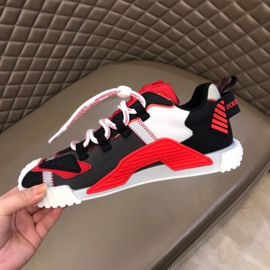 Dolce & Gabbana Red Trainer Outer Side Profile Hand holding Dolce & Gabbana red fabric trainer showcasing outer side details