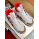 Top-down view looking down at the white, red and tan upper design of Dolce & Gabbana high-top trainers.