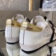 Golden Goose Trainers Gold Heel Tab View in white and gold Rear view of Golden Goose white leather trainers showcasing metallic gold heel tabs