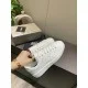 Top side view of Golden Goose Purestar white leather trainers with laces and star overlay