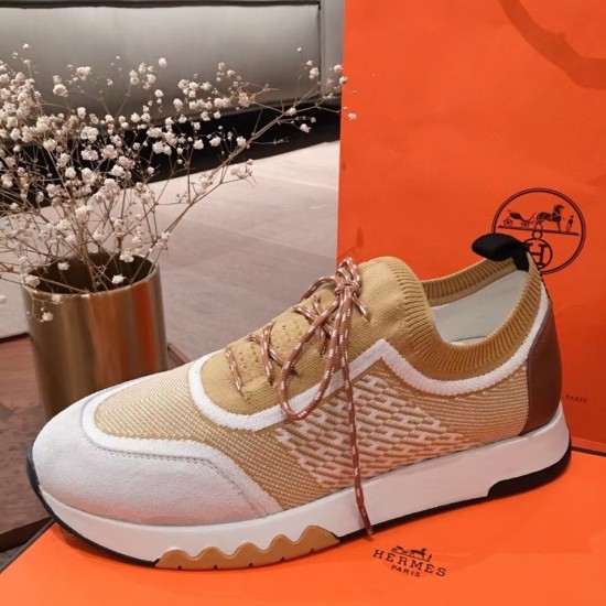 Hermes Addict Knit Trainers Lateral View in beige and white Full lateral side view of the Hermes Addict Knit Trainer in beige white with brown laces