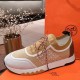 Hermes Addict Knit Trainers Lateral View in beige and white Full lateral side view of the Hermes Addict Knit Trainer in beige white with brown laces