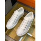 Top-down perspective of the pair of white leather trainers