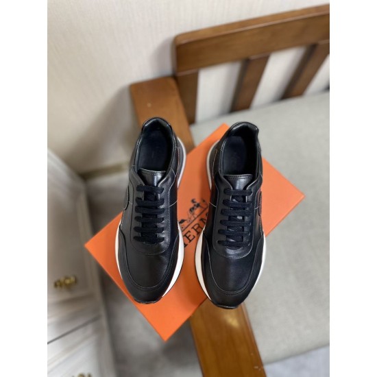 Hermes Drive Leather Low Top Trainers Black Pair Top View in black and white Top-down pair view of Hermes Drive Leather Low Top Trainers Black on orange box in black and white
