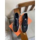 Hermes Drive Leather Low Top Trainers Black Pair Top View in black and white Top-down pair view of Hermes Drive Leather Low Top Trainers Black on orange box in black and white