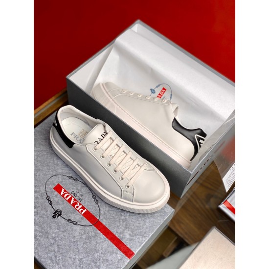 Prada Macro white and black leather trainers displayed in product packaging box