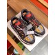 Versace Trigreca Black Trainers Top-Down View in black and yellow Pair of black Barocco print trainers viewed from above with attached brand identity tags in black and yellow