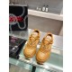 Overhead front view of Medusa detailing on brown Versace trainers