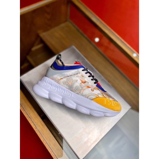 Versace Chain Reaction Baroque Print White Trainers Lateral Angle in white and yellow Lateral view of a single Versace Chain Reaction Baroque Print White Trainer showing the clear side cage in white and yellow