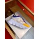 Versace Chain Reaction Baroque Print White Trainers Lateral Angle in white and yellow Lateral view of a single Versace Chain Reaction Baroque Print White Trainer showing the clear side cage in white and yellow