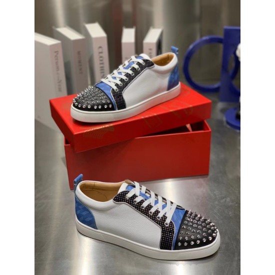 Christian Louboutin Louis Junior Spikes Orlato Angled Pair in white and blue Angled view of white and blue Christian Louboutin Louis Junior Spikes Orlato trainers with shoe box background