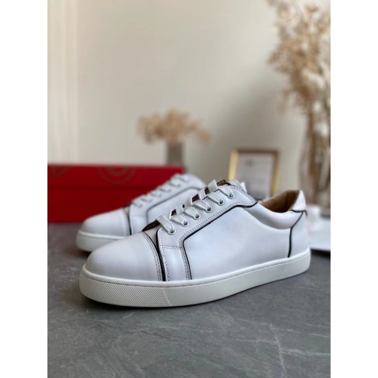 Three-quarter side angle of Christian Louboutin Vieirissima white leather trainers in white and black