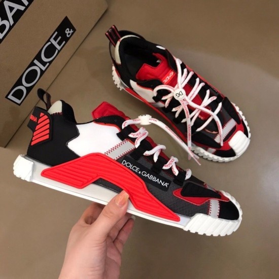 Dolce & Gabbana Red Fabric Trainers Pair with Packaging Hand holding Dolce & Gabbana red fabric trainer alongside paired shoe and branded box