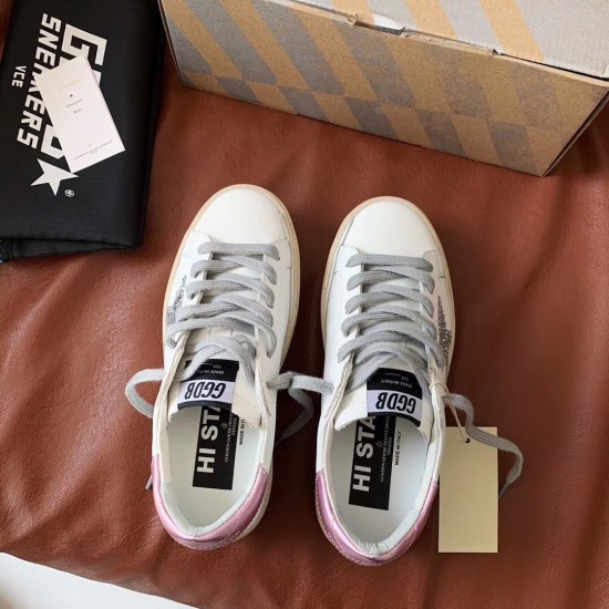 Top-down view of Golden Goose white leather trainers with grey laces and branded insoles in white and silver