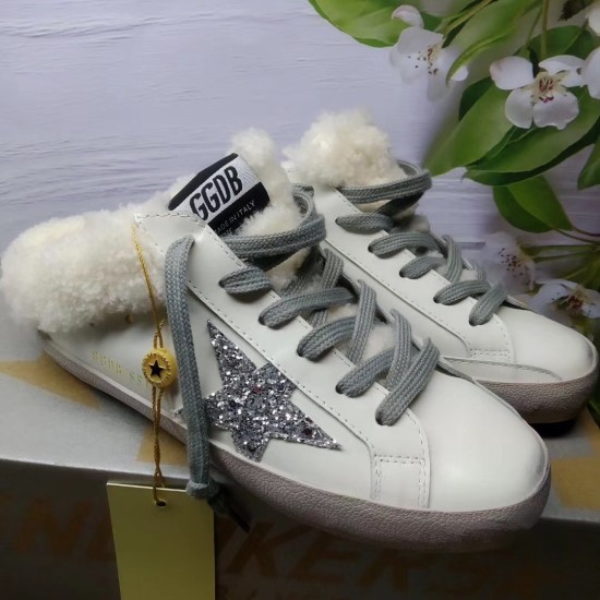 Golden Goose Super-Star Sabot Profile View in white Golden Goose Super-Star Sabot white leather shearling trainers three-quarter profile