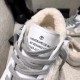 Golden Goose Super-Star Tongue Label Detail in white and grey Close-up of printed tongue label and grey laces on white leather Golden Goose trainer