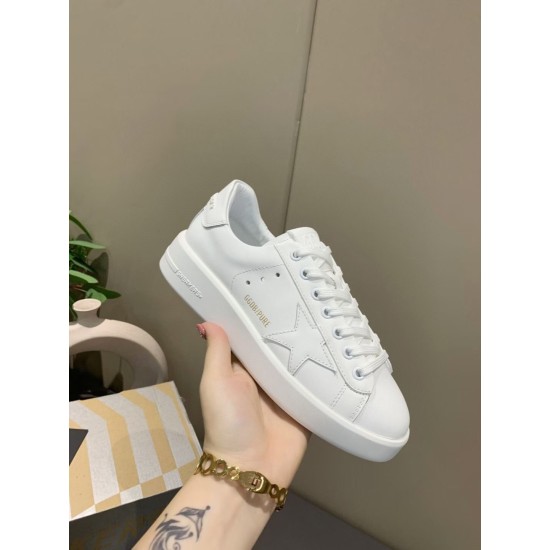 Close-up lateral view of Golden Goose Purestar white leather trainer with gold lettering