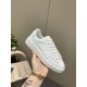 Close-up lateral view of Golden Goose Purestar white leather trainer with gold lettering