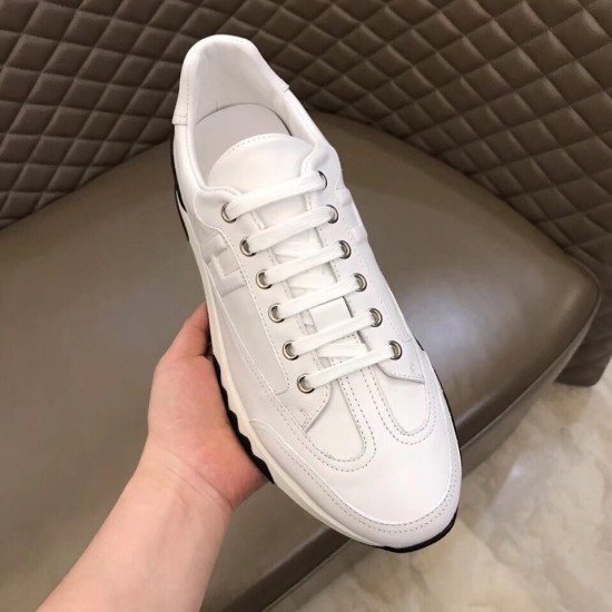 Trail Low Top Trainer Lacing and Toe View in white and black Front upper perspective showing the lacing system, eyelets and toe cap detailing of the white leather trainer in white and black