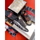 Versace Trigreca Black Trainers Packaging Set in black and yellow Top-down view of black Trigreca trainers presented with shoe box, dust bag and packaging in black and yellow