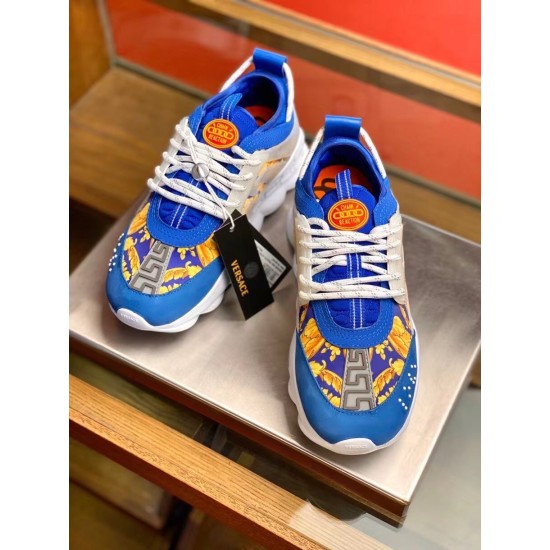 Front view of pair of Versace Chain Reaction blue baroque print low top trainers showing tongue logo patch in blue and yellow