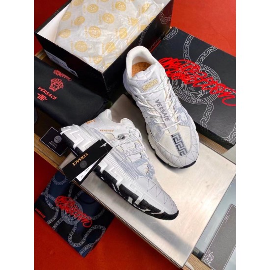 Versace Trigreca Low Top White Trainers Packaging View in white and gold Versace Trigreca Low Top White Trainers displayed with original shoe box and dust bag in white and gold