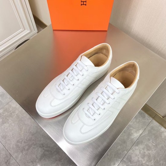 Hermes Boomerang White Trainers Top Down Pair View Top-down view of both Hermes Boomerang white leather trainers showing tan inner lining and white laces.