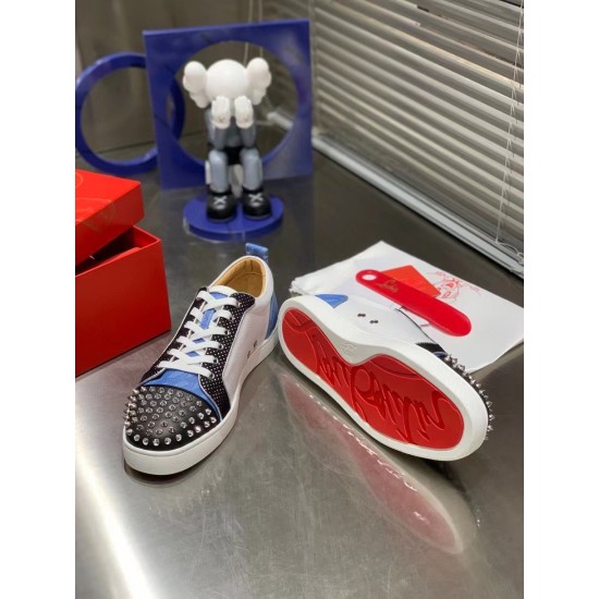 Christian Louboutin Louis Junior Spikes Orlato Red Sole View in white and blue Christian Louboutin Louis Junior Spikes Orlato trainer alongside inverted shoe revealing signature red rubber outsole in white and blue