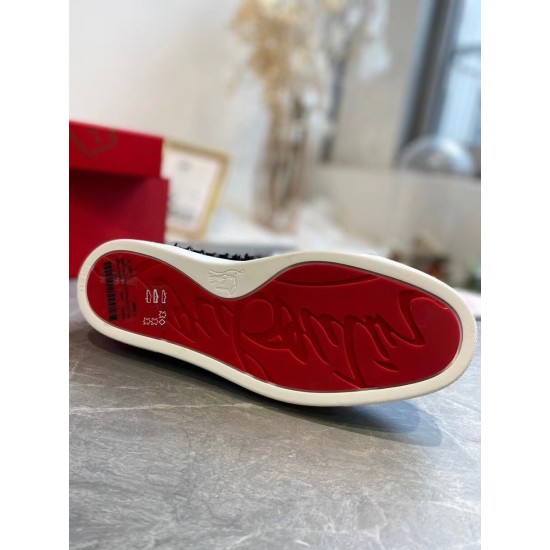Bottom view of Christian Louboutin Pik Boat Flat trainer displaying iconic bright red rubber sole in black and white