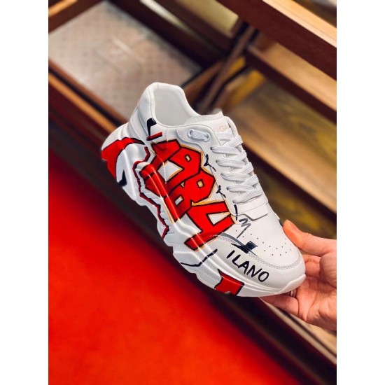 Dolce & Gabbana White Graffiti Leather Trainer Hand-Held View Hand-held close-up view of Dolce & Gabbana white graffiti leather trainer