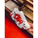 Dolce & Gabbana White Graffiti Leather Trainer Hand-Held View Hand-held close-up view of Dolce & Gabbana white graffiti leather trainer