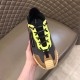 Dolce & Gabbana Grey Mesh Trainer Front View in grey and yellow Front view of a Dolce & Gabbana grey mesh trainer showing yellow eyelets and brown suede toe cap
