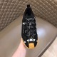 Top down view of Dolce & Gabbana black fabric trainer showcasing branded laces in black and tan