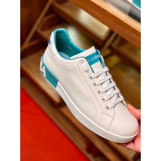 Dolce & Gabbana Portofino Trainer Handheld View in white and blue Handheld close-up of white Dolce & Gabbana Portofino Leather Trainer in white and blue
