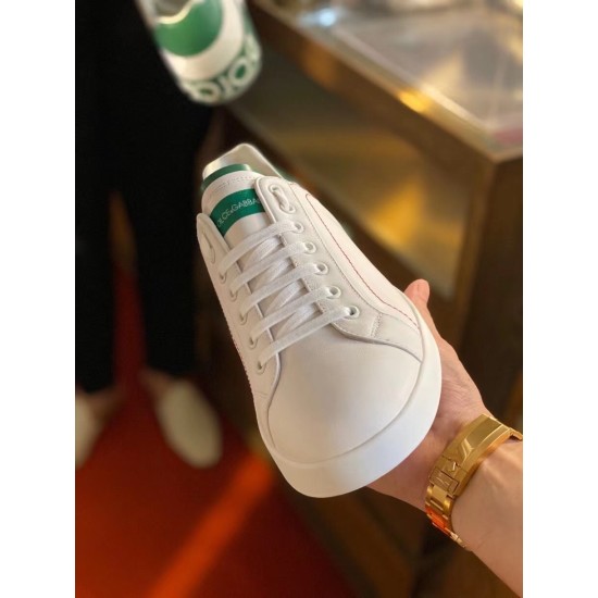Dolce & Gabbana Portofino White Trainer Toe View in white and green Handheld view of white leather Portofino trainer toe cap and lace-up front in white and green