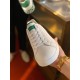 Dolce & Gabbana Portofino White Trainer Toe View in white and green Handheld view of white leather Portofino trainer toe cap and lace-up front in white and green