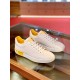Pair of Dolce & Gabbana Portofino Trainers in white and yellow Pair of white leather low-top trainers displayed on a glass shelf in white and yellow