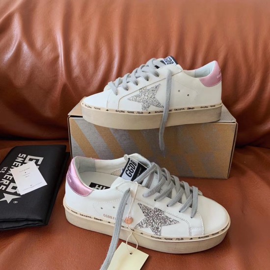 Both Golden Goose Hi Star white leather trainers displayed with grey laces in white and silver