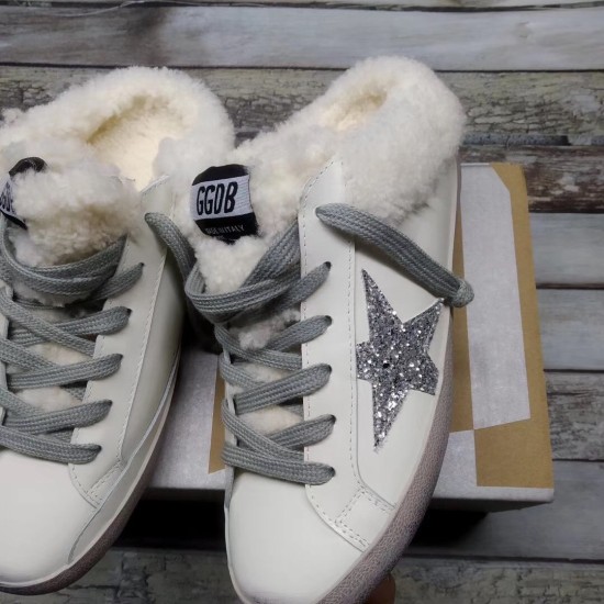 Golden Goose Super-Star Sabot Front View Pair in white Pair of Golden Goose Super-Star Sabot white trainers positioned front facing on box
