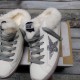 Golden Goose Super-Star Sabot Front View Pair in white Pair of Golden Goose Super-Star Sabot white trainers positioned front facing on box