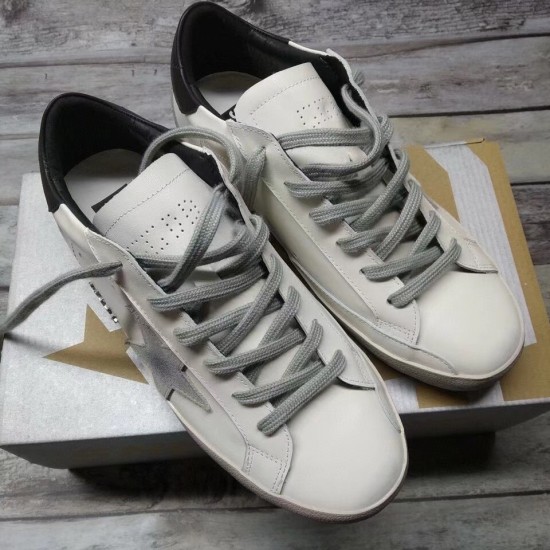 Golden Goose Super-Star Trainers with Box in white and grey Golden Goose Super-Star white trainers sitting on a branded shoebox in white and grey